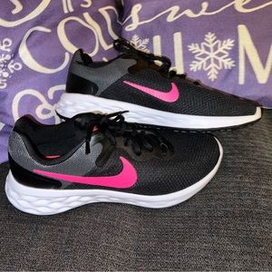 Women’s pink and black Nikes